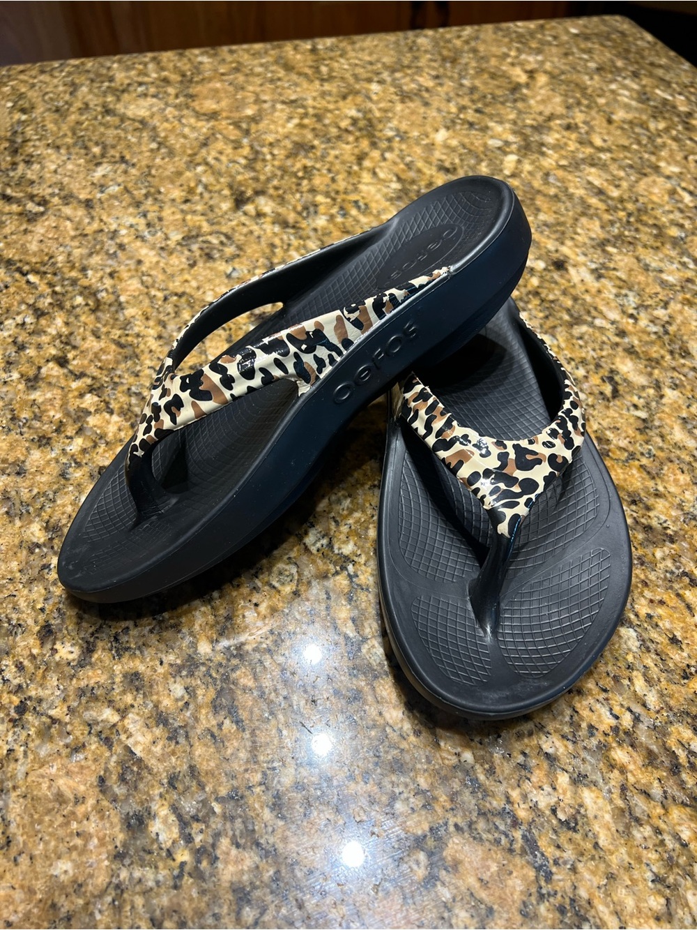 OOFOS Black Flip Flops with Leopard-Print Straps